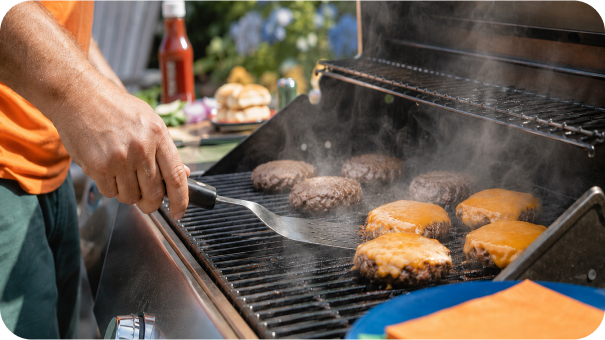 image of burgers cooking on natural gas grill