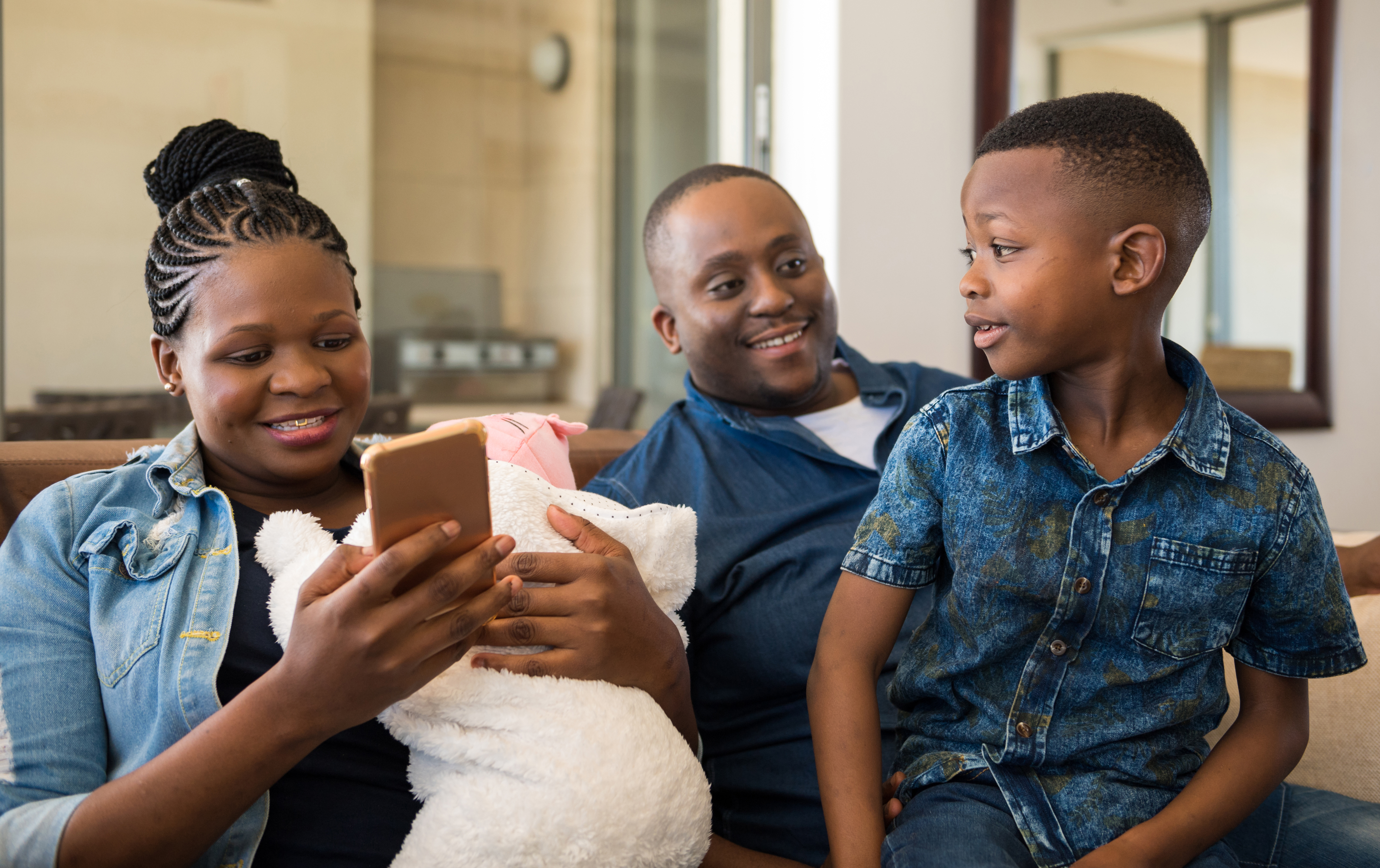 Woman using the new app with her family